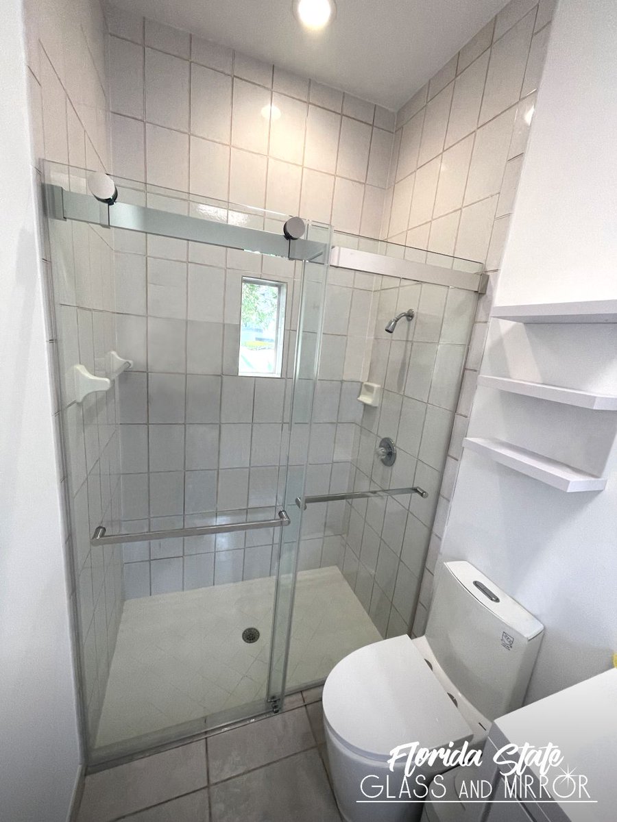 Our modern Frameless Sliding Shower Doors combine with your classic bathroom. Call Us Today at 561-997-6990 and Set your Free In-home estimate & Design Consultation Now! #framelessglass #slidingdoors #shower #showerenclosure #glassandmirrorexperts #glassexperts #floridastateglass