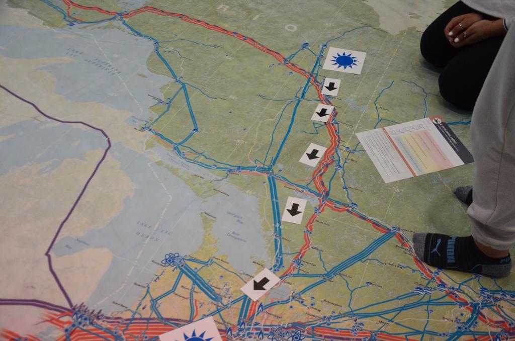 Grade 9 Geography students learning about Canadian energy production and transmission using a gigantic floor map.  The map is so large it would not fit in a classroom so the TLC moved a few book stacks to make room. <a href="/castlebrookess/">CastlebrookeSS</a> <a href="/patrika59/">Patrika Daws</a> <a href="/shakti_pat/">Shakti Patel</a>