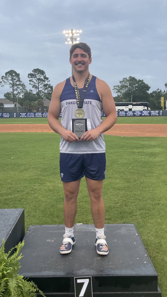 DSU_Athletics's tweet photo. 🏅 Conner Tordsen all smiles at the podium at the #NAIATrack Outdoor Nationals by being the ☝️st hammer thrower to be named NAIA All-America in @DSUTF program history.

#WeAreDSU #GoTrojans #DSUTrojanPride #DSUStrong #TrojanStrong #LoyaltoBlue #TrojanFamily #TrojanNation⚔️ https://t.co/KAVCsHwn0S