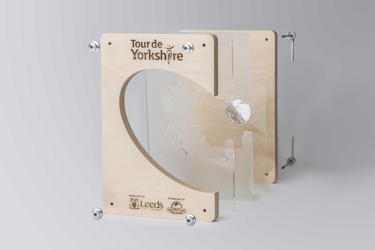 Missing #TourDeYorkshire? #Throwback to when they asked us to make a bespoke trophy. 

The #RunCNC cut the wood, the #motherfrickinlaser engraved the details &amp; cut the perspex. This isnt just a trophy, this is a Duke Makes Trophy🪚

Want help with a unique project? link in bio 👆