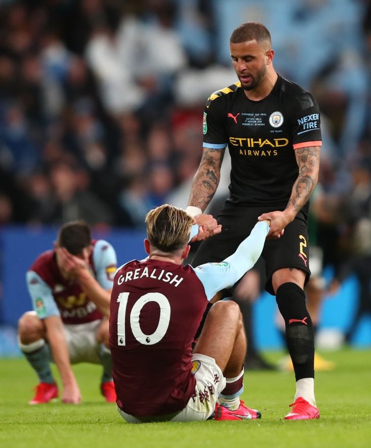Priceless_MCI's tweet photo. Walker consoling Jack Grealish after the League Cup final. Now PL champions as teammates https://t.co/fZj7TktyOO