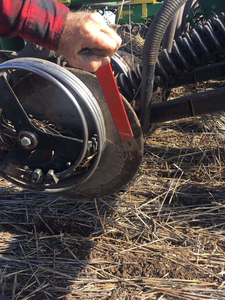 RodPohlner's tweet image. That $3 hose clamp stoped me getting out of the cab every 10mins to clean baked on mud off between the gauge wheel and the disc Usually I can run the wheel close or wide &amp;amp; one will work, when neither did the clamp stoped the build up but it did throw more mud so I made a mud flap