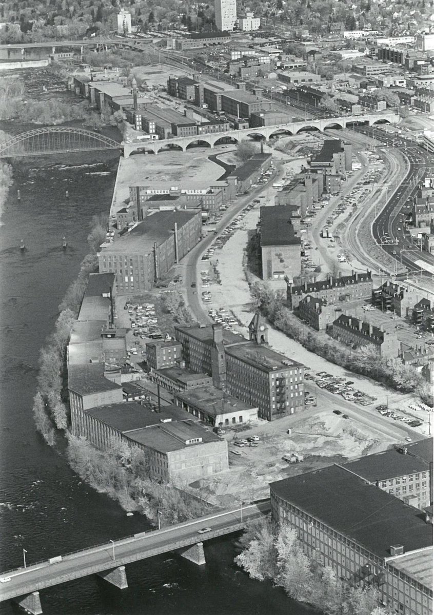 Savor this great Bob LaPree photo as Arms Park and the Riverwalk wait to take shape. Learn more about the tragic fate of the Arms Textile ⁦plant ⁦@MillyardMuseum⁩!