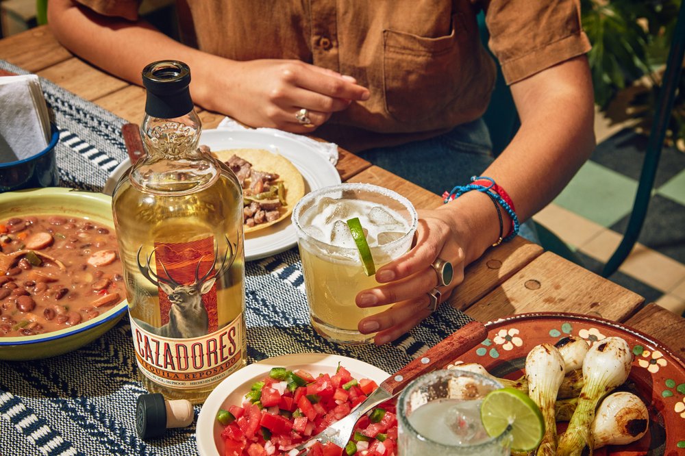 BacardiLimited's tweet photo. Happy 100th birthday to @TequilaCazadores! Missed out on celebrating a special moment? Claim it back with #Caz100. #Cazadores is helping people make up for lost time &amp; fun with party packs customized for celebrations you've missed over the past 2 yrs. https://t.co/WnboceALv9 https://t.co/4KtlajckB5