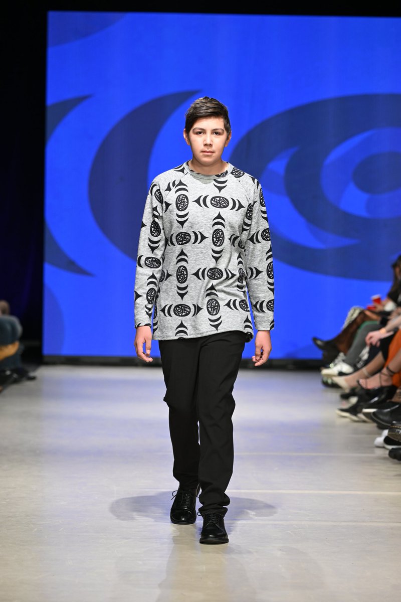 aylelum's tweet photo. Menswear is coming soon...
Here is our new Men's Knit Wolf Eye if Life Top. 🐺 As seen @VanFashionWeek and modeled by our Raymond!
Pre-order now on our website https://t.co/PeXxlSW6ha
Artwork by Joel Good
#CoastSalishFashion #Indigenousbc #IndigenousFashion #indigenousmodel https://t.co/I1mMtQVsSe