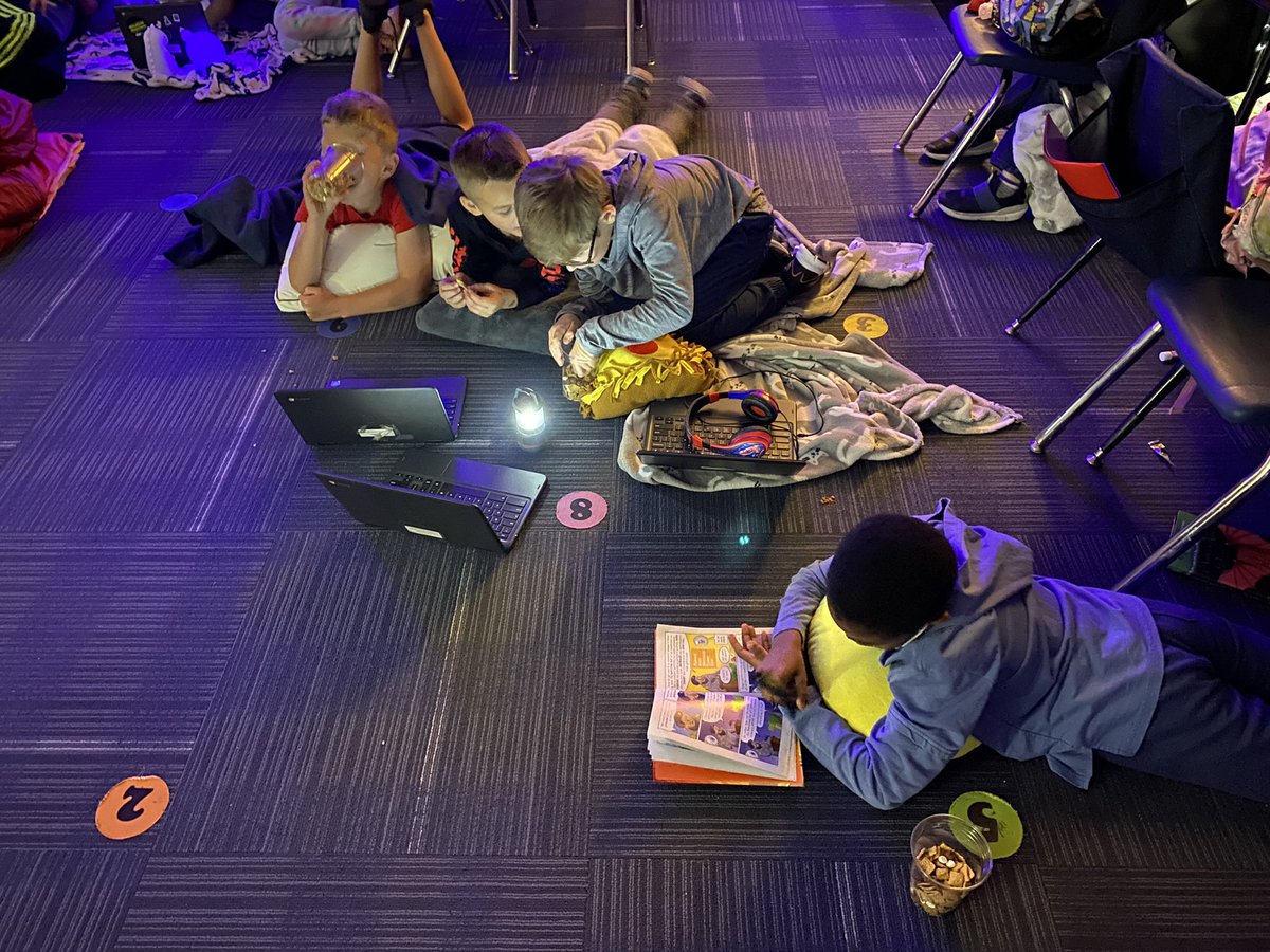 billiamlor's tweet photo. Students enjoying camp style reading with blankets, pillows, flashlights, and s’mores cereal. https://t.co/NMzxixqCBq