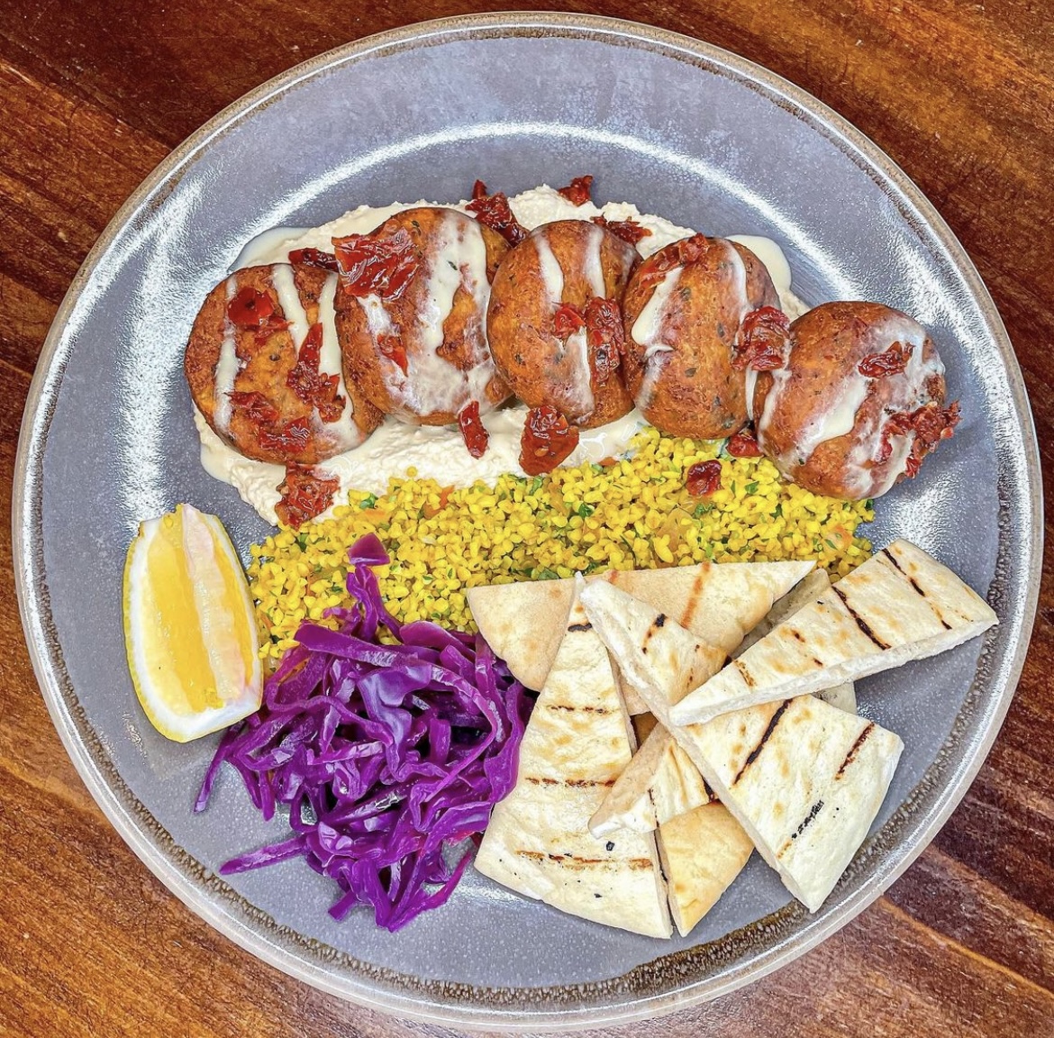 Featuring our Falafel Platter served with Hummus, Tabbouleh Salad, Pickled Red Cabbage, Sundried Tomato, Flatbread & Tahini Sauce. Getting hungry? 🤤