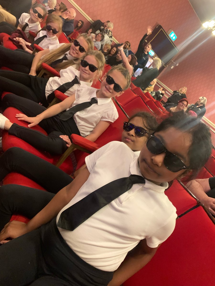 HoltFarmJunSch's tweet photo. After weeks of training and effort our Dance Club represented our school at a dance festival which was held at the Palace Theatre. They all looked the part in their costumes as they performed a Men In Black routine. https://t.co/mqRK3iijWc