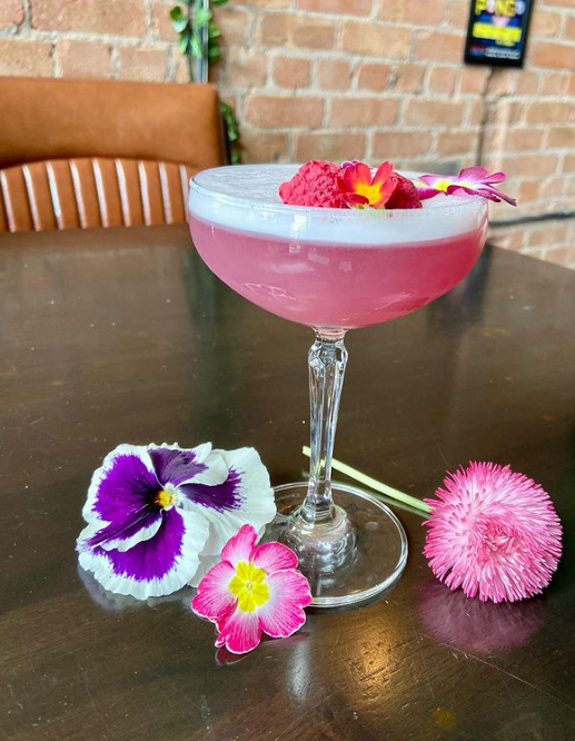 We're serving our new cocktails including this Vimto sour with edible flowers 🌸

And we will have live entertainment from the Skive band at 9pm playing all your favourite Manc tunes - if you're mad for it, come and see us