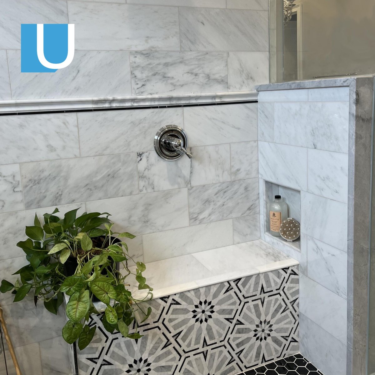 UnivStone's tweet photo. This bathroom is an absolute STUNNER  
 
We can't stop drooling over this Carrara Marble Shower with a black marble shower pan and a mosaic accent on the bench.👏 
 
#universalstone #bathroomdesign #bathroomremodel #bathroom #bathroomtiles #showerdesign #marblebathroom https://t.co/mnkih0HrD3