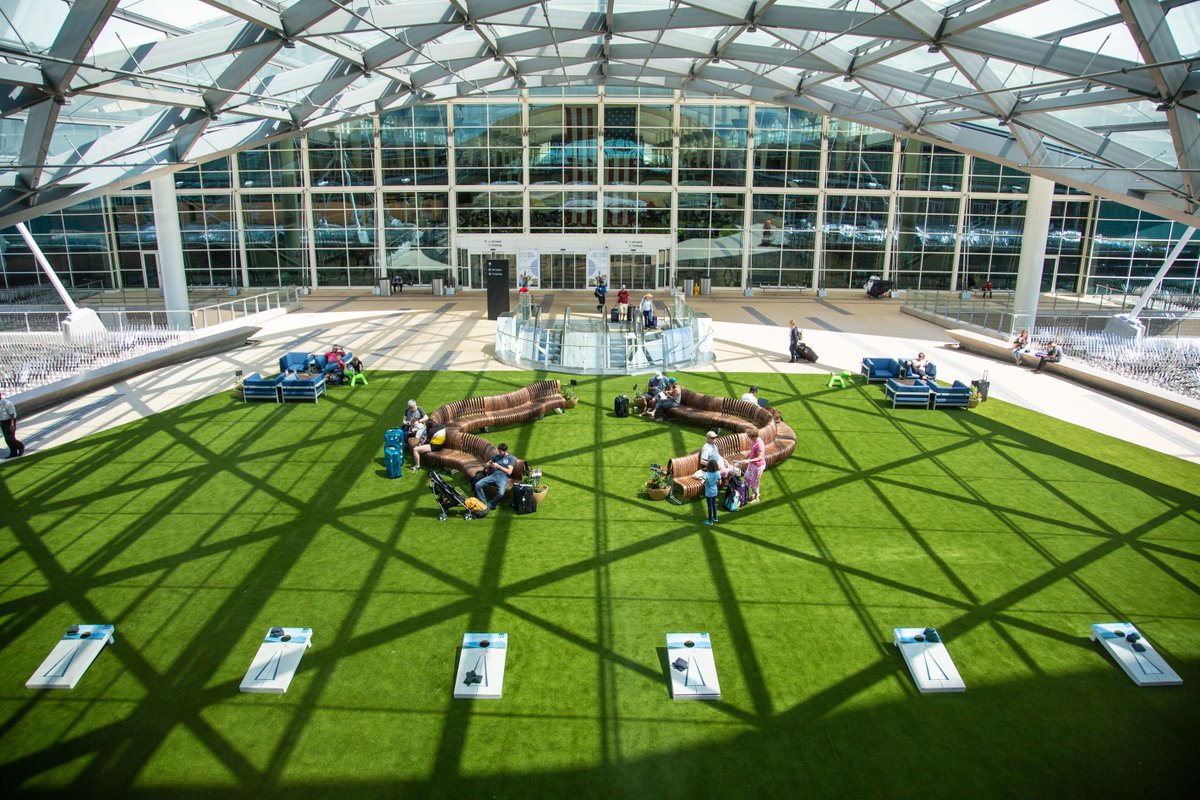 DENAirport's tweet photo. DEN's Park on the Plaza is now open daily through Oct. 2! Play a game of corn hole, relax on the grass-like turf or chill on lounge seating while enjoying Colorado-native plants and trees. Kick your feet up and stay a while (but don't be late for your flight 😉) 🌳 🤸♀️ #DENevents https://t.co/actvKJmay4