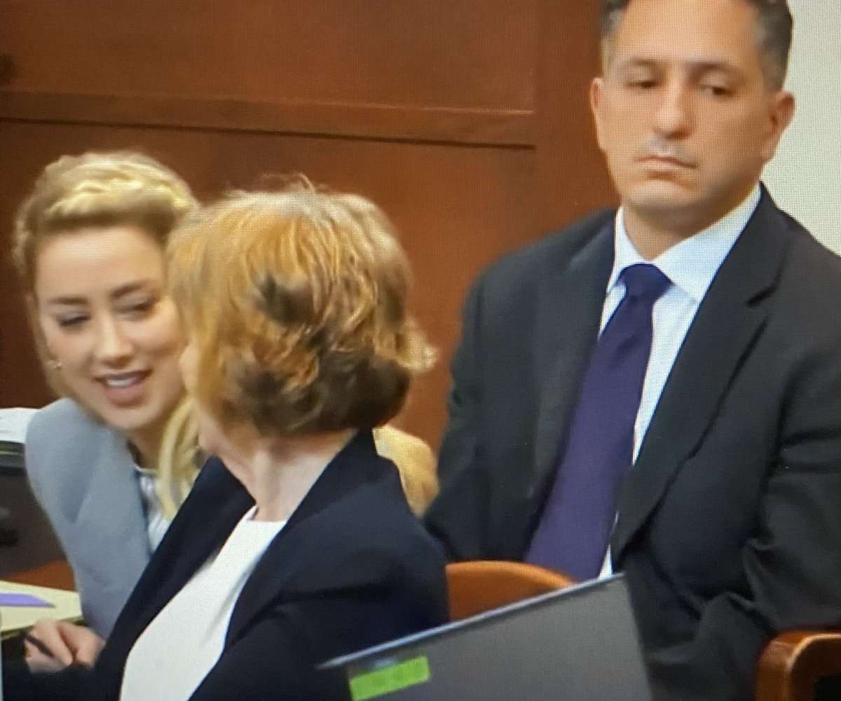 TheCrimeDiva2's tweet photo. #AngryAmber is looking snarky and appears to be laughing and enjoying the closing arguments today. She is something else. ⚖️ #AmberHeardIsALiar #JusticeForJohnnyDepp #JusticeForJohnny #JohnnyDepp https://t.co/znJlTUqyBi