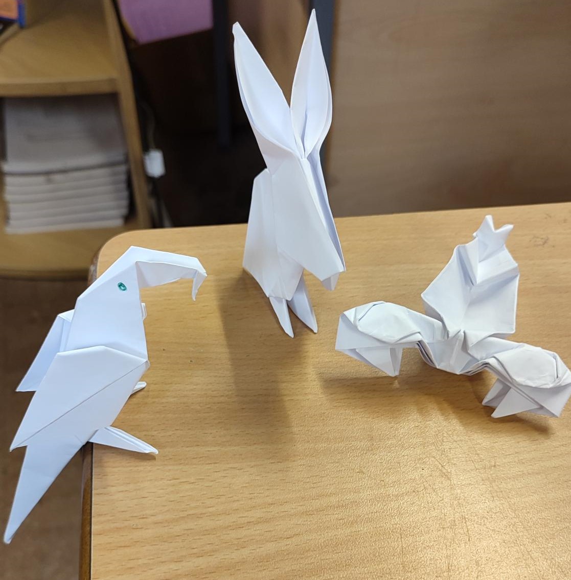 FlintHighDT's tweet photo. Excellent demonstration of accuracy through the ancient art of paper folding. From left to right... parrot, rabbit and scorpion #paperengineers #Origami https://t.co/bvjkzLc2fm