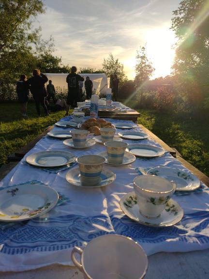 Jubilee Tea Party. Cucumber sandwiches, sausages on sticks, scones, china tea service and a birthday cake. All out in the fresh air, making for a thoroughly enjoyable evening. #platinumjubilee #explorerscouts #herefordshire #scoutinginleominster #creamtea