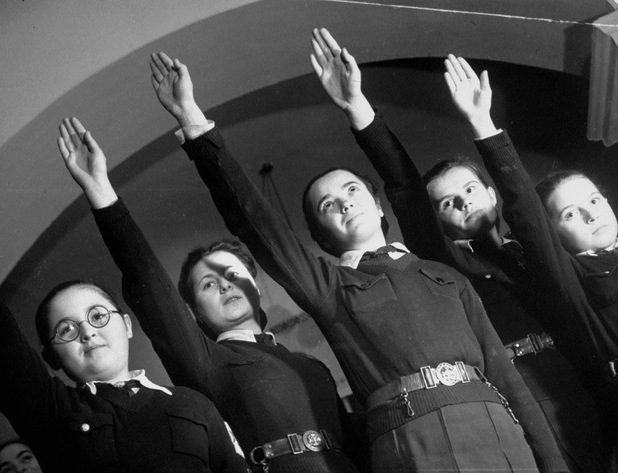 Fascist youth saluting, Romania in 1940 by Margaret Bourke-White.