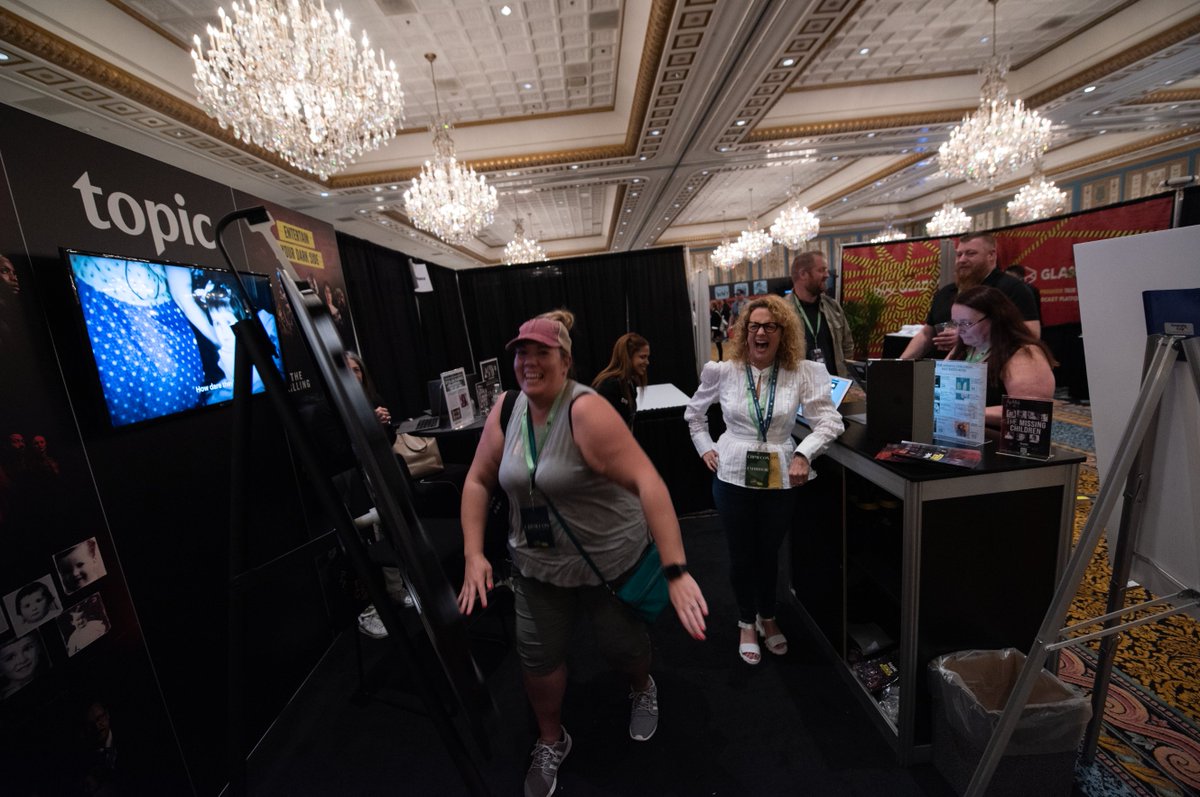 MoCoPho's tweet photo. So the @topicstories booth at @CrimeCon was super lit. All that good energy and enthusiasm makes my job so much fun. Thanks for the great photos, y'all! #spinthatwheel #joyiscontagious #crimecon2022 #lovemyjob #lovethesevictimadvocates #mocopho https://t.co/0G434ceXtB