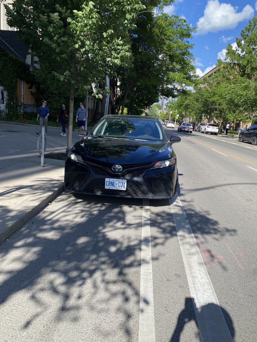 PowerfulBike's tweet photo. @Uber please remind your drivers they are not entitled to block bike lanes: 'but I'm just waiting to pick up my passenger' said driver of this car on Harbord. Perfectly good laneway 2 meters behind him. https://t.co/uiQ9mjdaWR