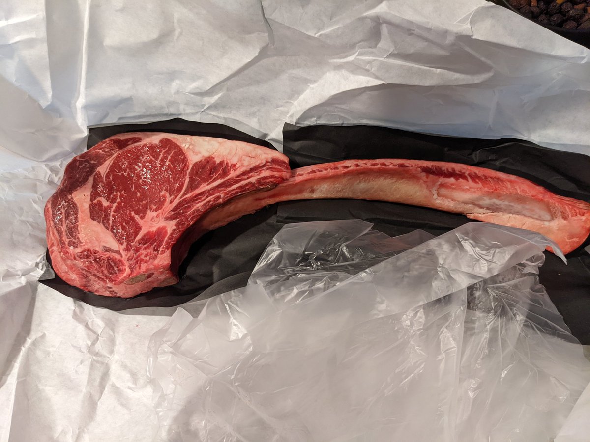 kyleheon's tweet photo. Tonight we dine one dinosaurs! Reverse searing in the #Primo followed by high temp sear directly over an open flame with the #Breeo. Baked potatoes cooked in the hot coals. https://t.co/hsalHQTH5v