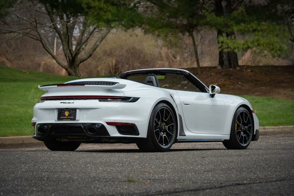 PorscheMarket's tweet photo. This 2022 #Porsche 911 Turbo S is finished in White over a Red/Black interior. It has 2,720 original miles, has a PASM sport suspension that lowered the vehicle 10mm and is sitting on 20x21" 911 Turbo S exclusive design wheels. #PorscheMarketplace

▶️ https://t.co/ilTJQavk42 https://t.co/ttXrT6TLXI