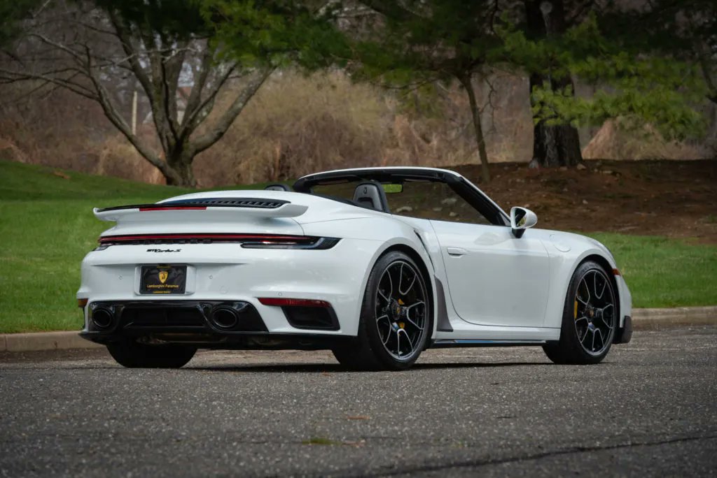This 2022 #Porsche 911 Turbo S is finished in White over a Red/Black interior. It has 2,720 original miles, has a PASM sport suspension that lowered the vehicle 10mm and is sitting on 20x21' 911 Turbo S exclusive design wheels. #PorscheMarketplace ▶️ porschemarketplace.net/vehicles/2022-…
