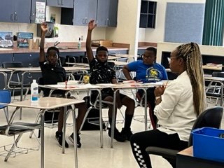 presleycharles's tweet photo. What a way to start the summer @WatkinsSeminol1 with our Summer Scholars Program. Our scholars were entrenched in hands on learning with citing text-based evidence and understanding fraction using manipulative! I Love it! #Scholars #Forwardsteps https://t.co/MpCob7dLvi