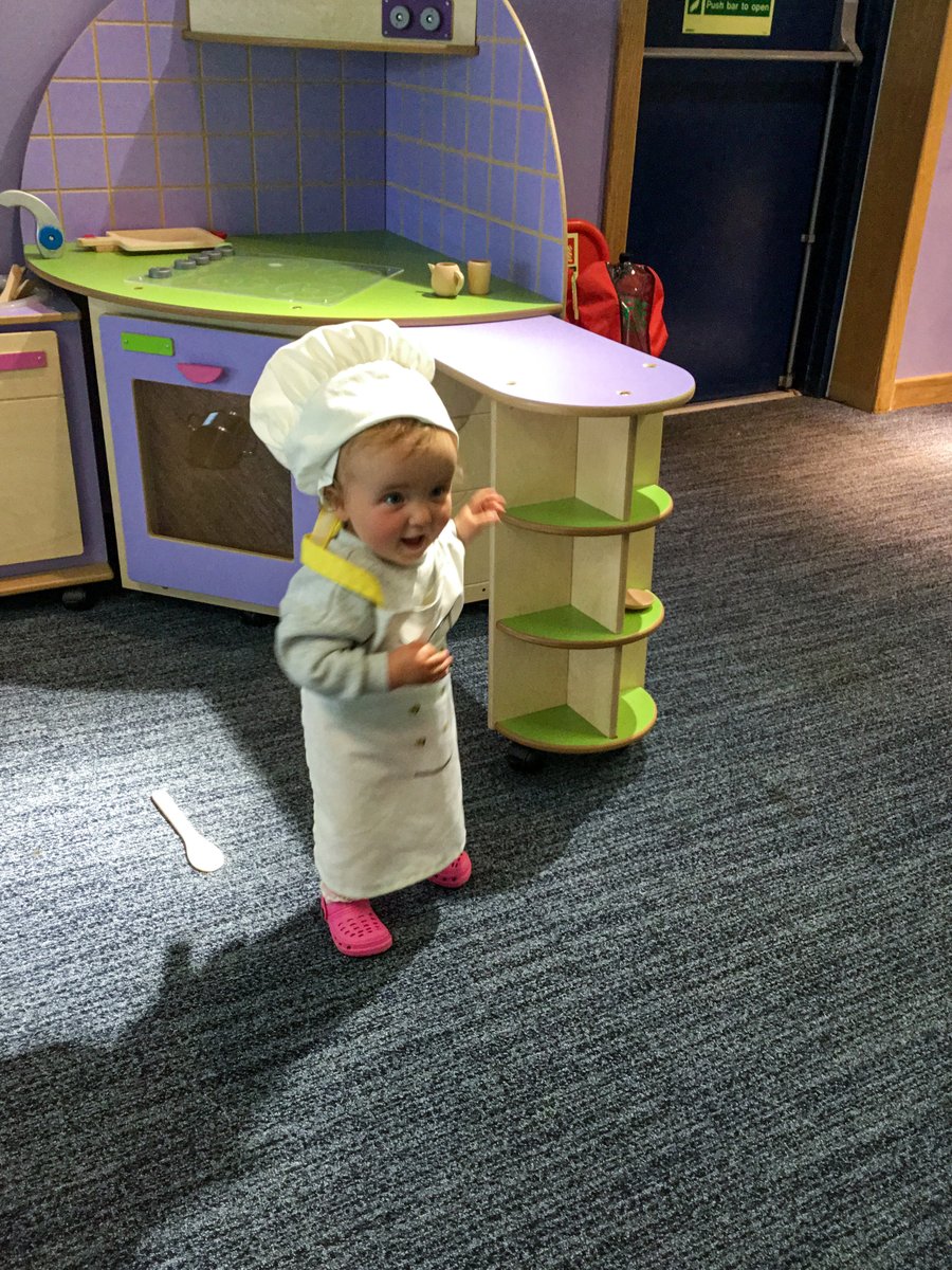 NACLibraries's tweet photo. Our new children's library at Irvine is proving to be a big hit. Here's one of our young readers cooking up a storm in the kitchen area. https://t.co/rwFffBEUCj