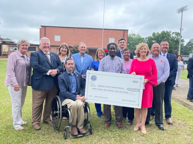 saludaschools's tweet photo. A great day for @saludaschools, as State Superintendent of Education, Molly Spearman, presented a check for $38,000,000 to our district, to go toward facility and infrastructure improvement projects in all five schools! Watch the press conference here: https://t.co/14epIQ0AOP https://t.co/bJ15Y4P20m