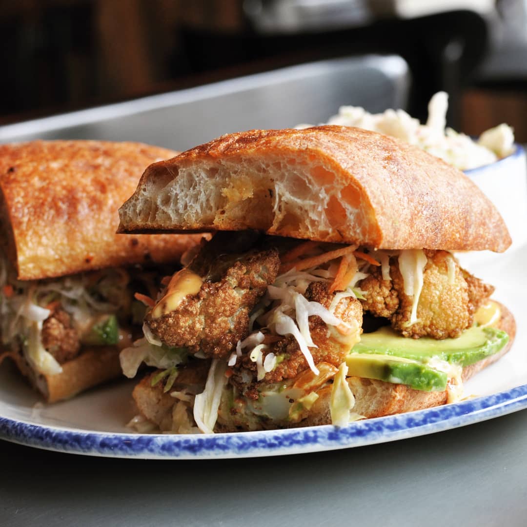 Hit it rich with our Cauliflower Po' Boy! We're open at 12pm and have got a bar stool with your name on it. See you soon!