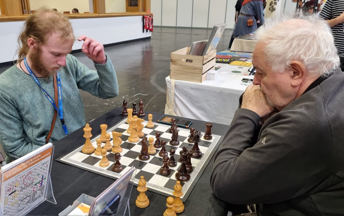 ChessPlus's tweet photo. @UKGamesExpo This is @ChessScholar demonstrating how to play #Halma on chessboard. We met many #educators. We also played #Nim or solved #MathsProblems on chessboard. And who knew #Vikings were into #Chess? #ukge2022 #chessplus https://t.co/Nc8ehuJ0kO