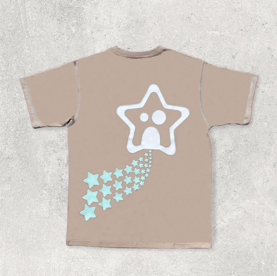 _on1025_'s tweet photo. INTERSTELLAR KAI T-SHIRT - EARTH  

180 GSM (5.31 oz) 100% beige cotton fleece t-shirt. 

Screen printed Kai and Bellatrix in white with mint puff printed outline &amp; puff printed stars 

AVAILABLE 6/18/22, 12:30 PM PT #on1025 https://t.co/vuOS74OuKM