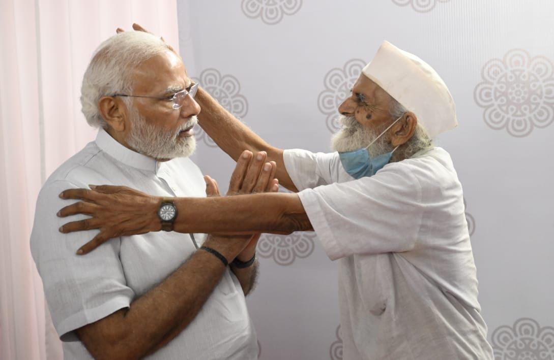 PM Narendrabhai Modi meets his school teacher Jagdishbhai in Navsari