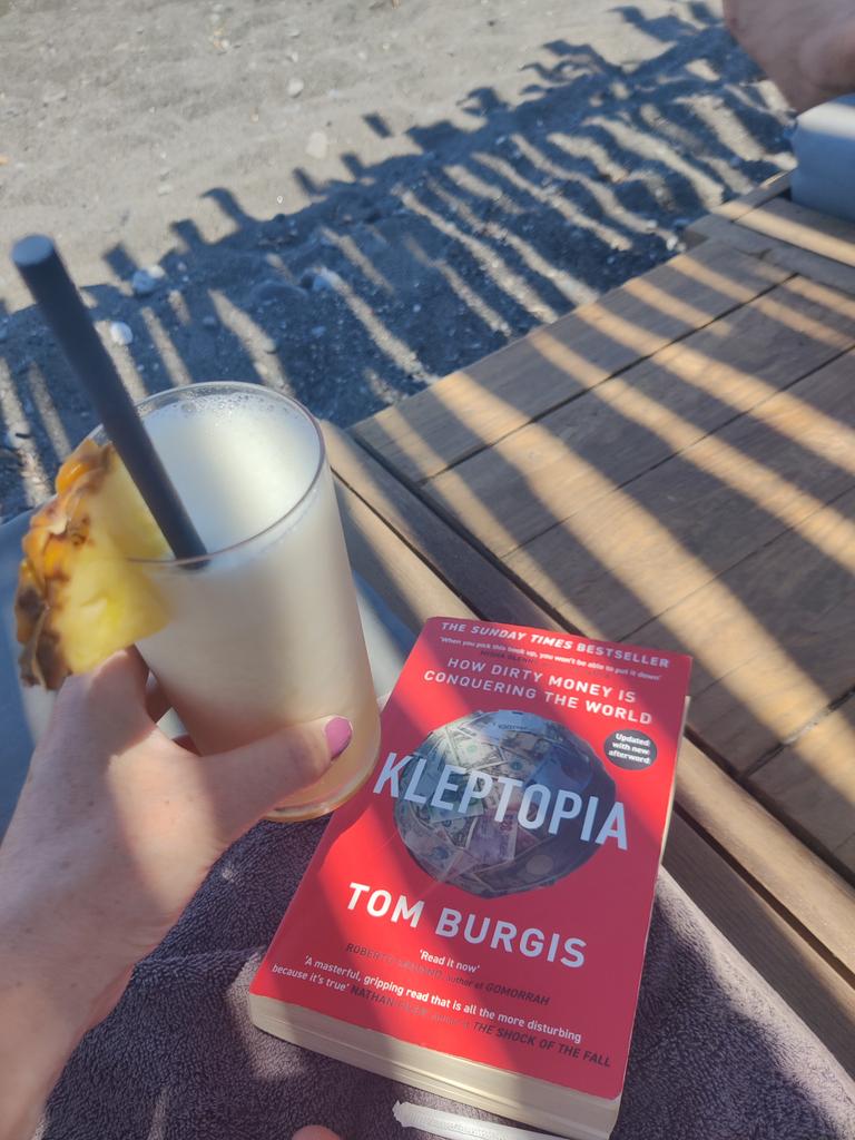 pmt_89's tweet photo. Great read. Telling my non-reader husband how much he'll love the film that'll inevitably be made from it. Wonderful, necessary work by @tomburgis 

(Pina colada also necessary)
#beachread2022 https://t.co/FzUclYCvmZ