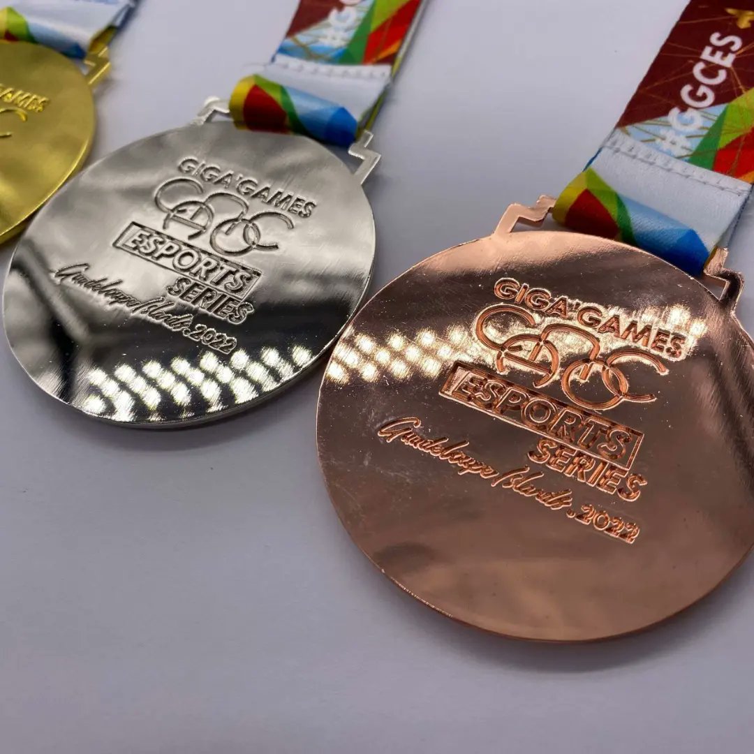 ggic_gigagames's tweet photo. They are here! The magnificent GOLD, SILVER and BRONZE medals of the GIGA'GAMES CANOC ESPORT SERIES. #GUADELOUPE2022 😍🤩 .  Who will shine the colors of his country, from June 29 to JULY 03 in #Guadeloupe ? #ggces22 #gggic #gigagames #caribbeangames #internationalgames #eSports https://t.co/iV0Mem8rwc