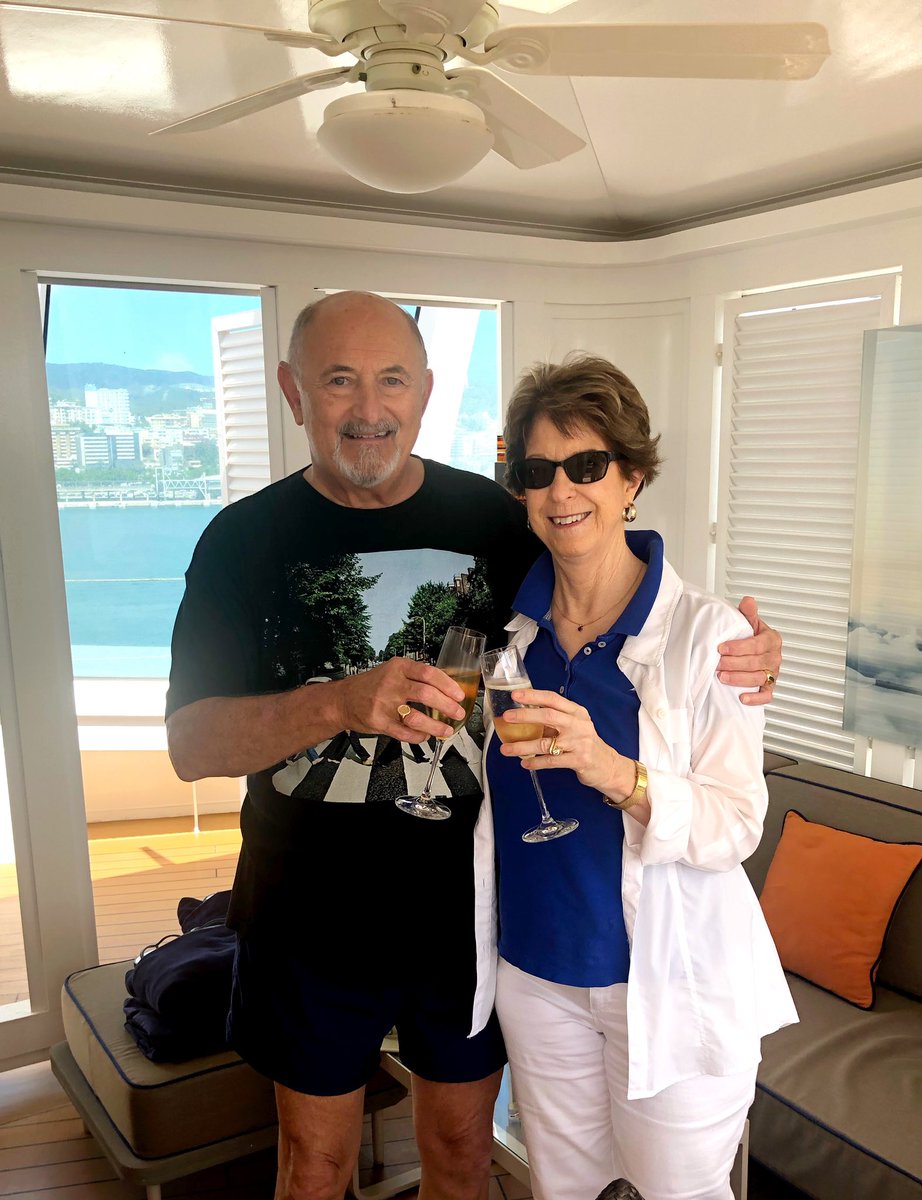 gigi_langer's tweet photo. Peter & I have loved every minute of our holiday in Italy, France & Spain. Headed home on Sunday. Here we are relaxing in a cabana by the pool today. (My champagne is #alcohol-free, just in case you wondered!) #recovery #soberlife #worrylessnow https://t.co/DwN6gjkEob