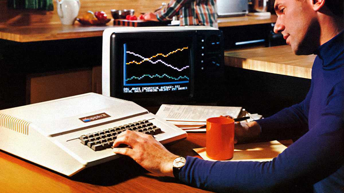 A man using an Apple II in 1977, from an Apple II advertisement.
