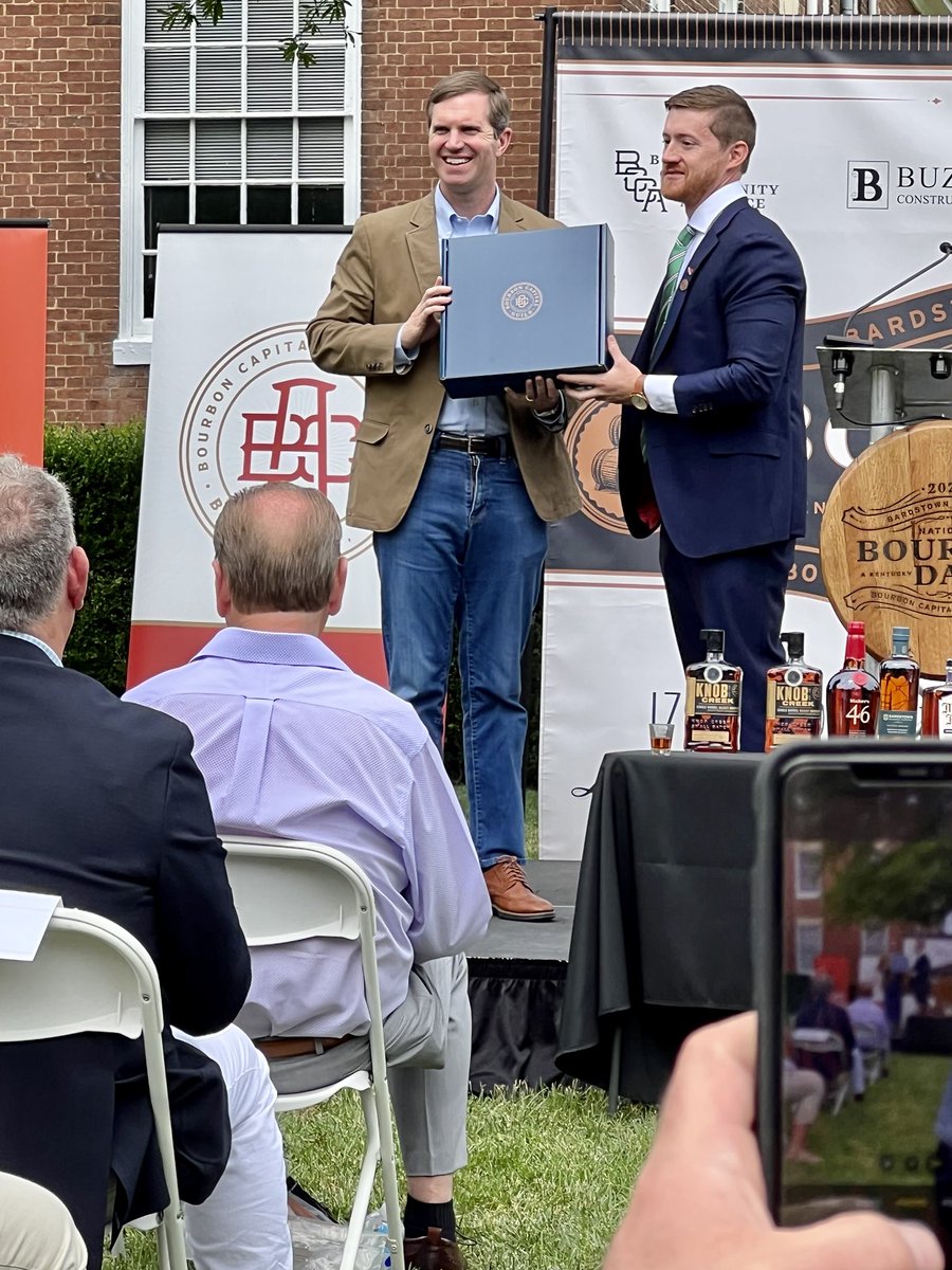 #BourbonComesFromBardstown . #GovernorAndyBeshear accepts his honorary membership into the #BourbonCapitalGuild from executive director Sam Lacy in ⁦@visitbardstown⁩ during #NationalBourbonDay. ⁦@KentuckyTourism⁩