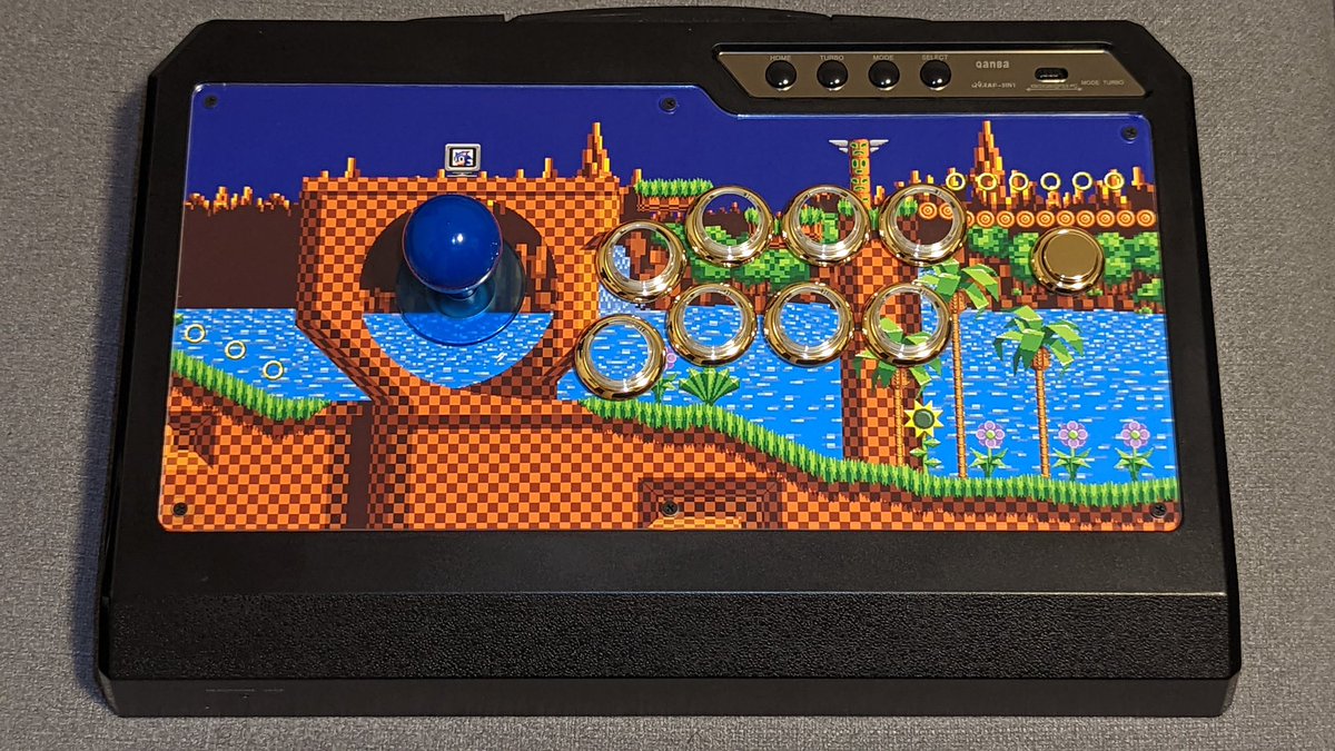 BlueWizard422's tweet image. My 1st #FightStickFriday showcasing my Qanba Q4RAF with a Green Hill Zone motif. Gold rings for the buttons and a blue ball top for Sonic. Shoutout to @focusattack for the parts and artwork!
