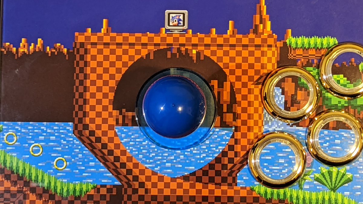 BlueWizard422's tweet image. My 1st #FightStickFriday showcasing my Qanba Q4RAF with a Green Hill Zone motif. Gold rings for the buttons and a blue ball top for Sonic. Shoutout to @focusattack for the parts and artwork!