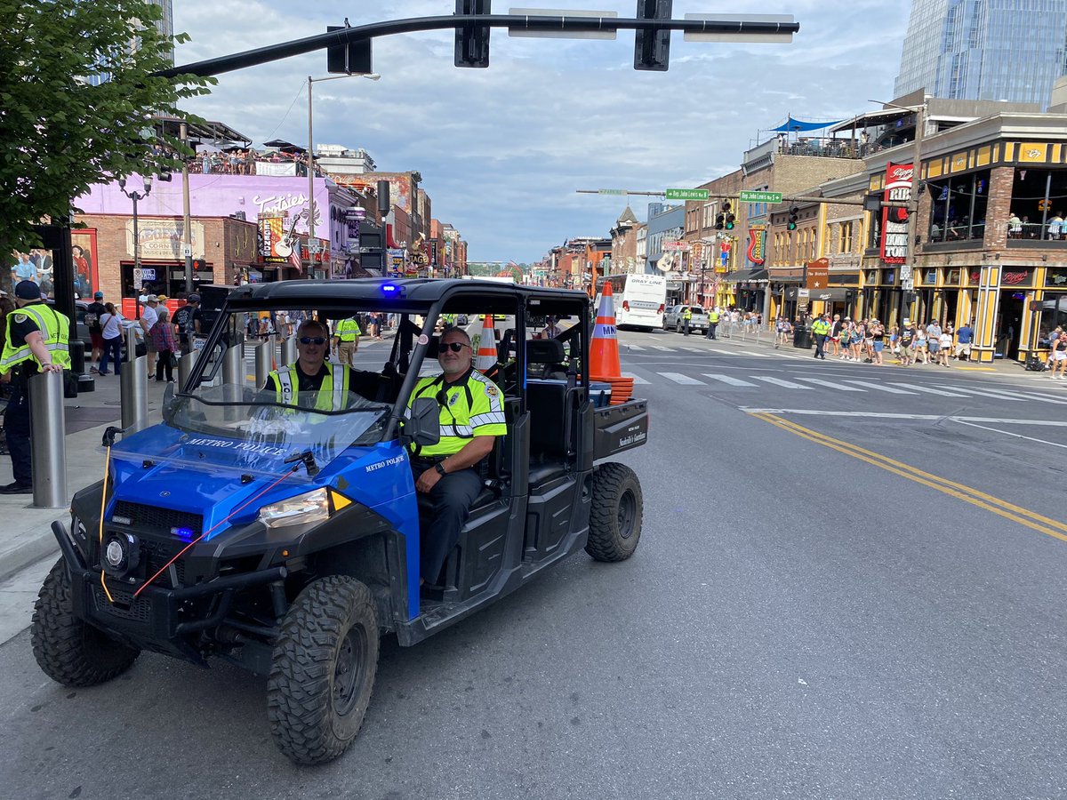MNPDNashville's tweet photo. Officers are making sure the downtown footprint is safe for @CountryMusic Fest attendees on this warm Friday in Nashville. They’ll be working security and traffic posts throughout the weekend. Remember, if you see something, say something to a nearby officer. https://t.co/rXurI1ngqX