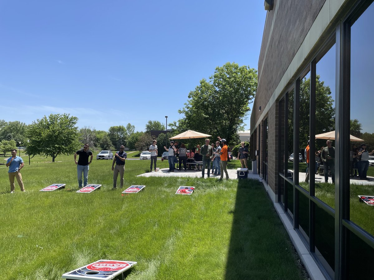 Sometimes, you just need a break to play bags and hold a baby! #teambonding #teamwork