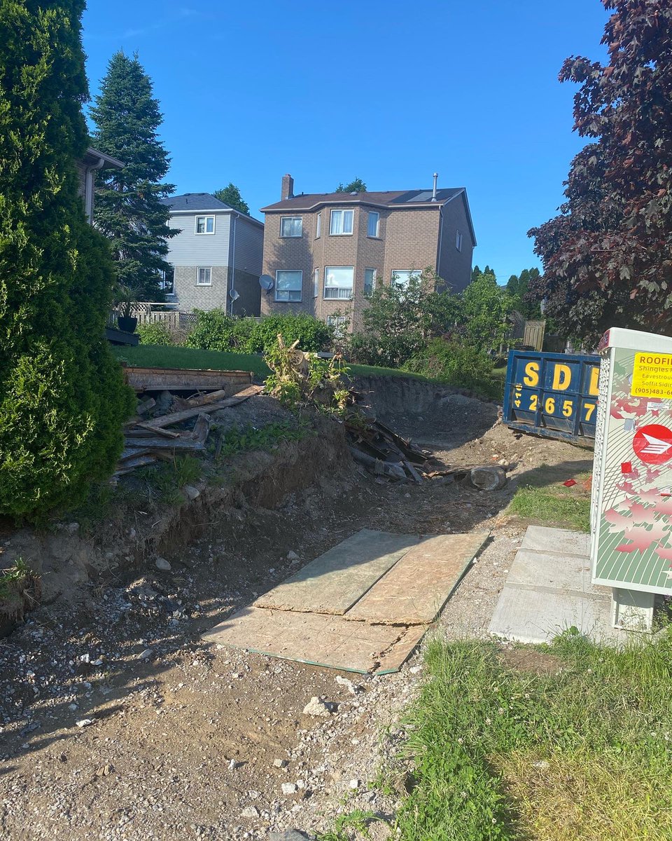 TracyHuntington's tweet photo. @TownOfAjax should be ashamed!! This was supposed to be a retaining wall replacement. Eight feet of backyard gone and whole sidewalk is gone. Contractors are no shows for best part of a month 🤦‍♀️ Please get your shit together. Totally unacceptable 😡 https://t.co/RFfFHxTyzA