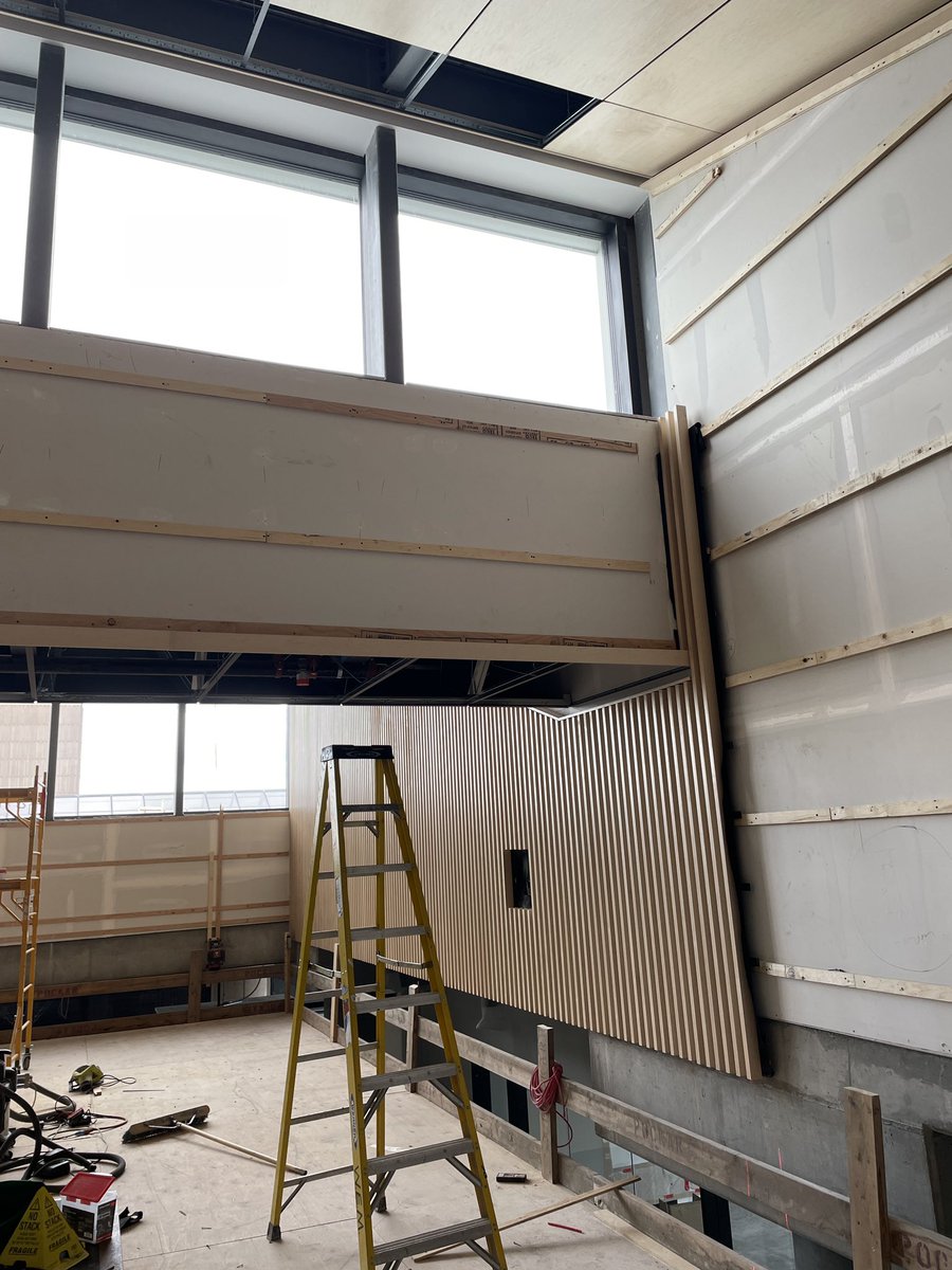 EDMathisonHall's tweet photo. Wood paneling is going into place in our atrium. Photos from our temporary 4 story scaffold . #MathisonHall #EllisDon #Haskane #construction #Ucalgary https://t.co/l8FXQNuMNg
