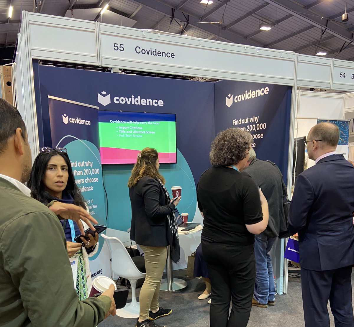 Covidence's tweet photo. It’s all happening at stand 55! Come by and say hello 👋 #Covidence #SystematicReview #UKSG2022 @UKSG @magsvanderesch @HelenEllisCO https://t.co/Hv7duhuVlE