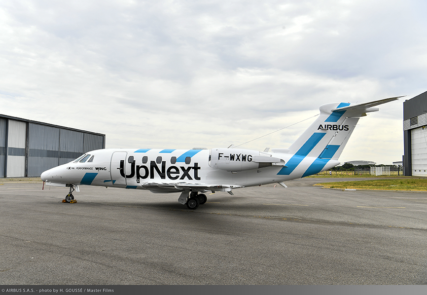 Airbus's tweet photo. ⬜️🟦 Airbus' latest demonstrator ✈️ is freshly painted ⬜️🟦! 
The eXtra Performance Wing demonstrator, accelerated by #AirbusUpNext, will test wing aerodynamics and performance to reduce CO₂ emissions. Next step? Integration of some very special wings! 🔗 https://t.co/09D1JWo7oW https://t.co/kVdRNX0IC9