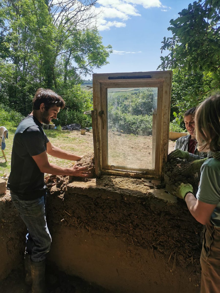 cobbuilding's tweet photo. Cobbers fixing a window into a cob wall https://t.co/cqDApX15jR