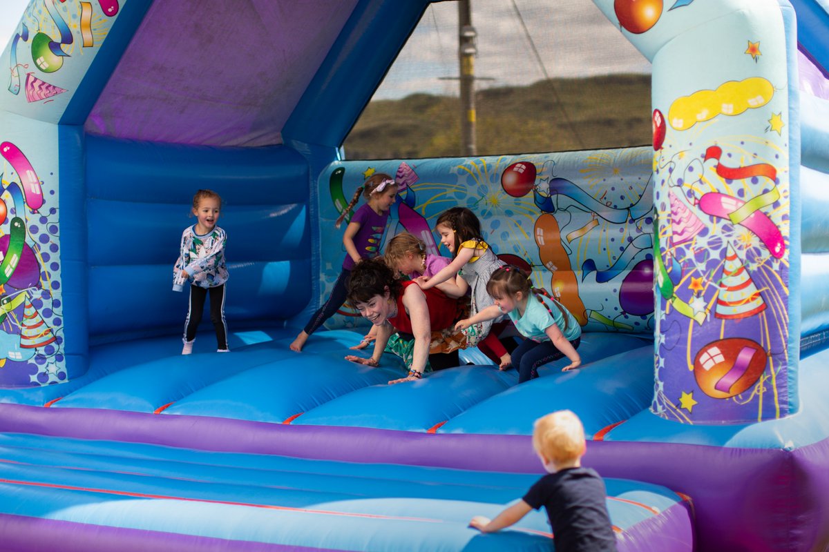 IKDT16's tweet photo. A super Family Fun Day on Saturday! Islanders, their family &amp; friends loved the bouncy castle, rodeo bull, mural project and music from the new Oban Drumming group, DJ David and the Etive Ceilidh Band! Huge thanks to @TNLComFund for support https://t.co/fhmTqVV0yE