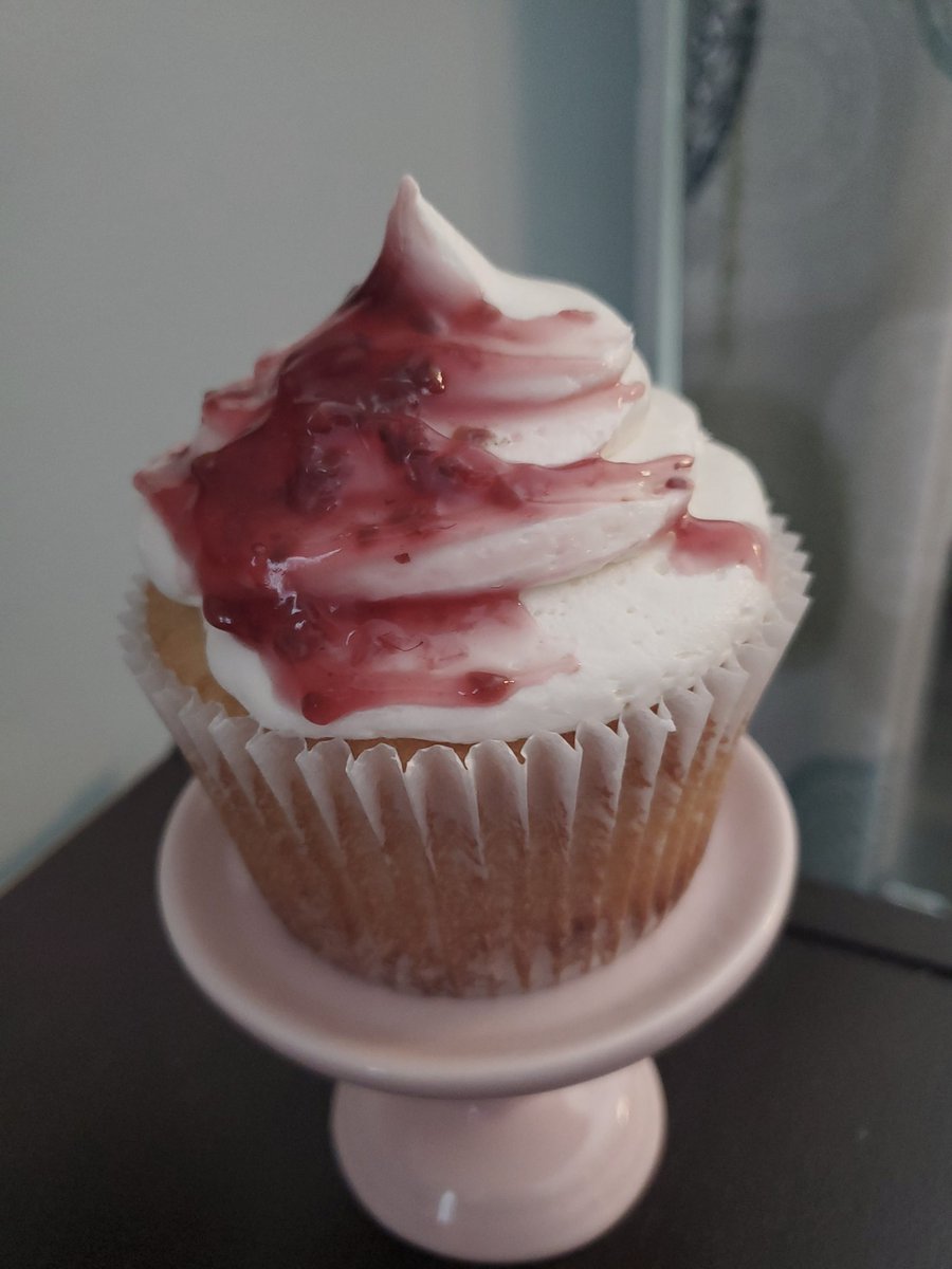 Raspberry filled Vanilla Jumbo Cupcakes with Vanilla Buttercream. $5 each.  I have 8 left. Anytakers?