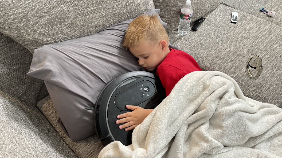 TaunStewart's tweet photo. @EcovacsUS son discovered our old deebot in the closet.  It has been through a lot and no longer works but has become his favorite friend and toy! https://t.co/yohbu4UF9T