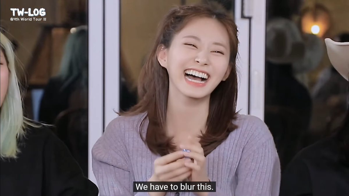 A woman with long hair in a lavender sweater laughing joyfully, with the caption 'We have to blur this.' and a 'TW-LOG @4th World Tour III' watermark in the corner.