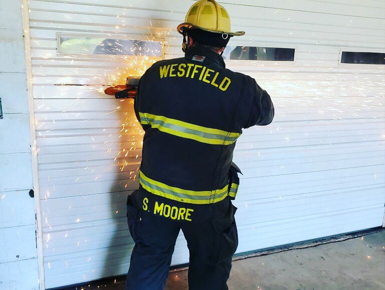 WestfieldFire's tweet photo. Westfield crews exercised forcible entry skills on commercial doors and the correct procedure for cutting through garage doors. #trainingmatters #forcibleentry #savinglives #savingproperty https://t.co/JfJbpBUNI7